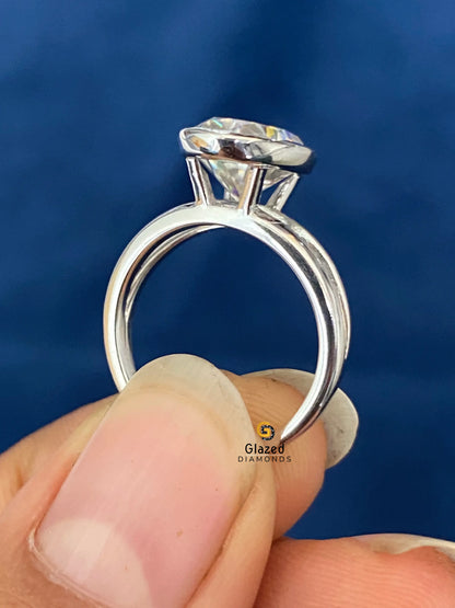 Oval Abstract Bezel Set Solitaire Diamond Ring
