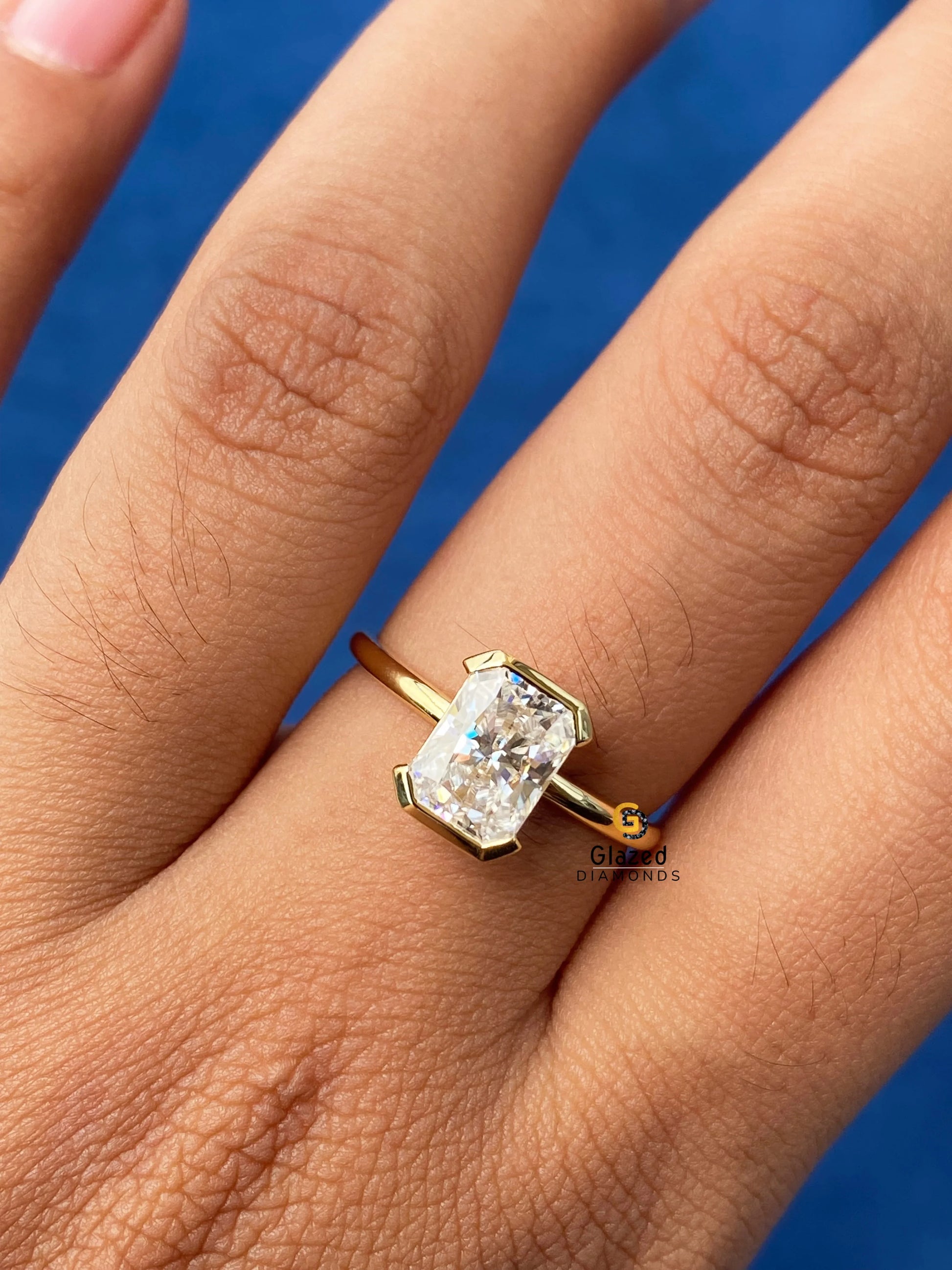 Radiant Half Bezel Set Moissanite Engagement Ring